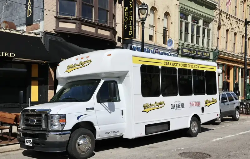 Our shuttle bus parked on North Dr. Martin Luther King Jr. Drive in downtown Milwaukee outside Who's on Third